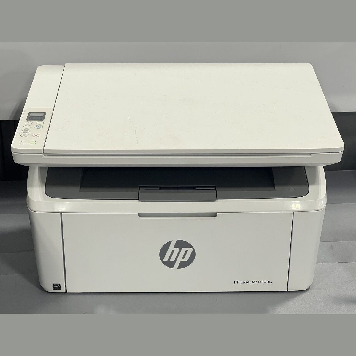 Stock photograph of an office printer, standing in for a picture of the HP LaserJet M211dw mono printer