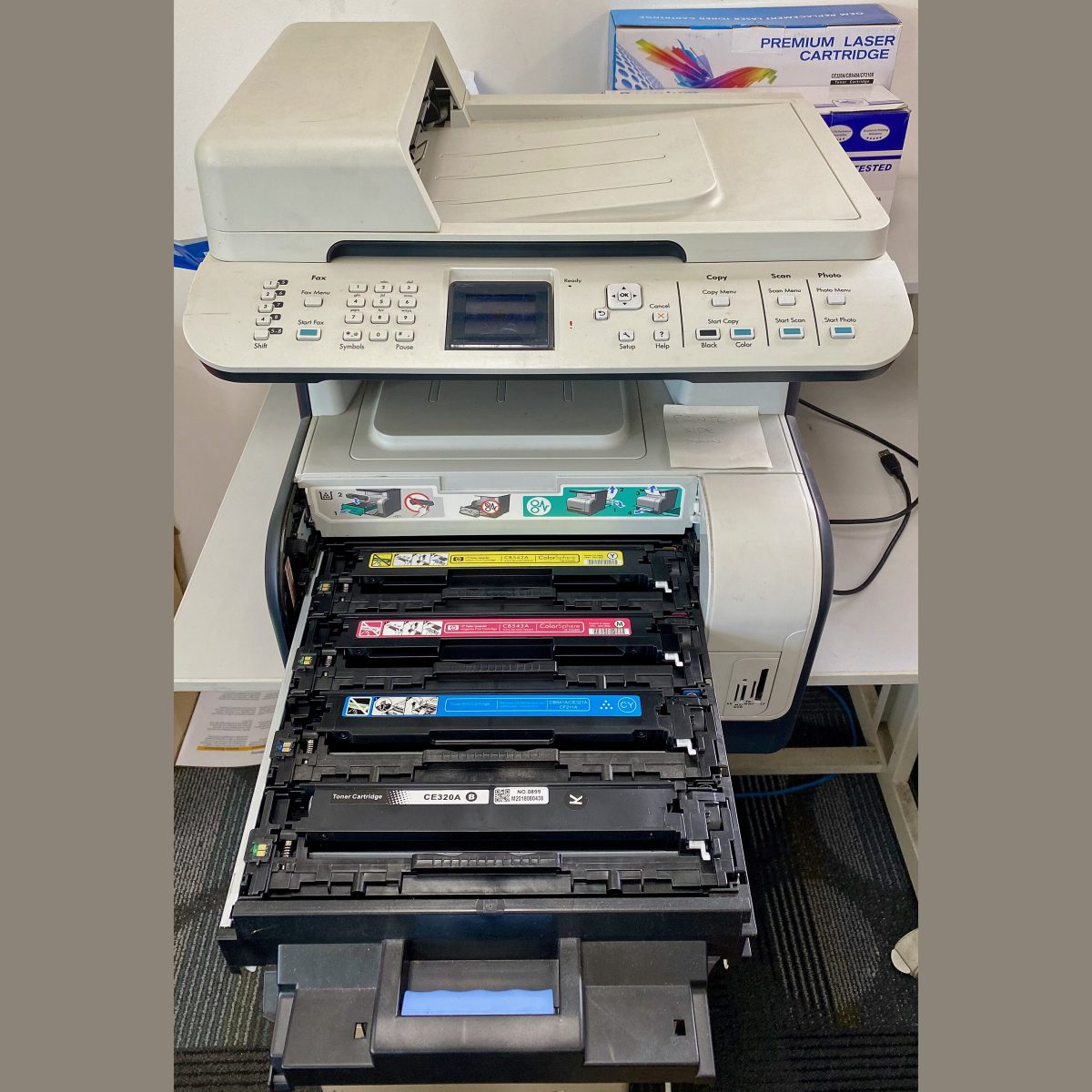 Stock photograph of an office printer, standing in for a picture of the Canon imageCLASS MF3010 mono printer, scanner and copier