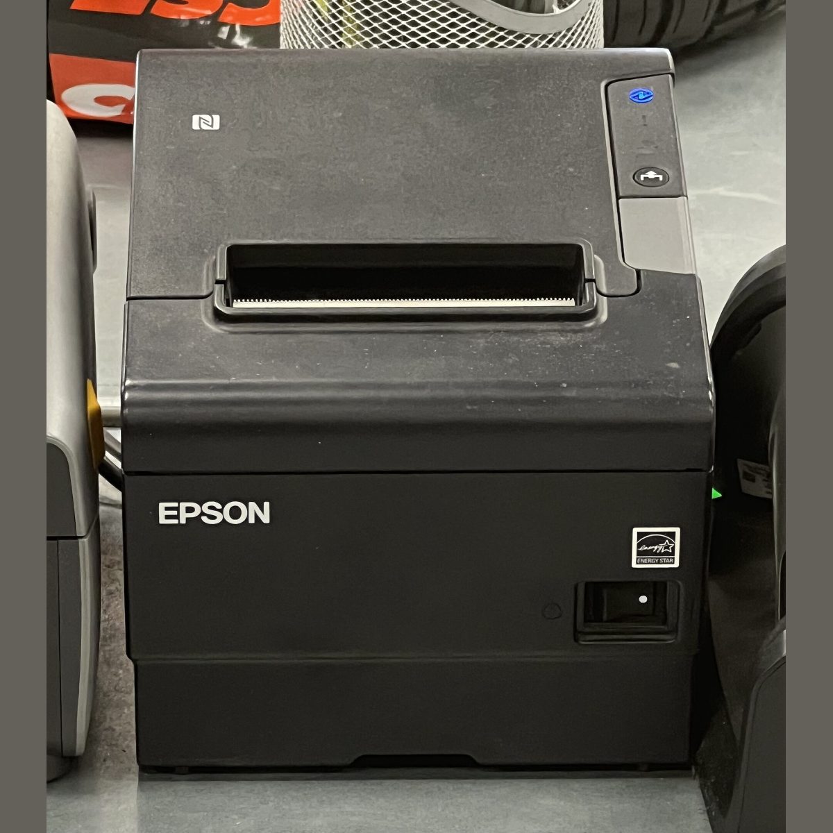 Stock photograph of a receipt printer, standing in for a picture of the Xprinter XP-80C 80mm thermal receipt printer